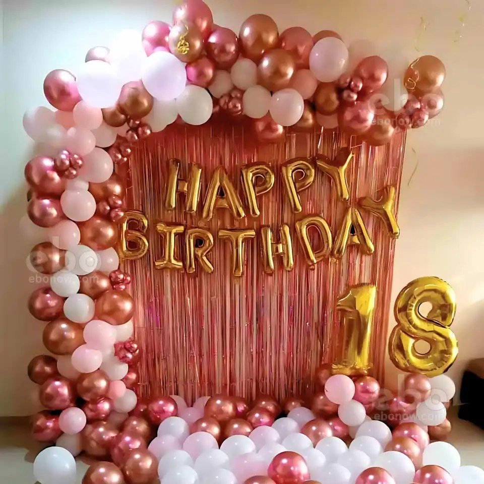Gold balloon garland and metallic Happy Birthday backdrop